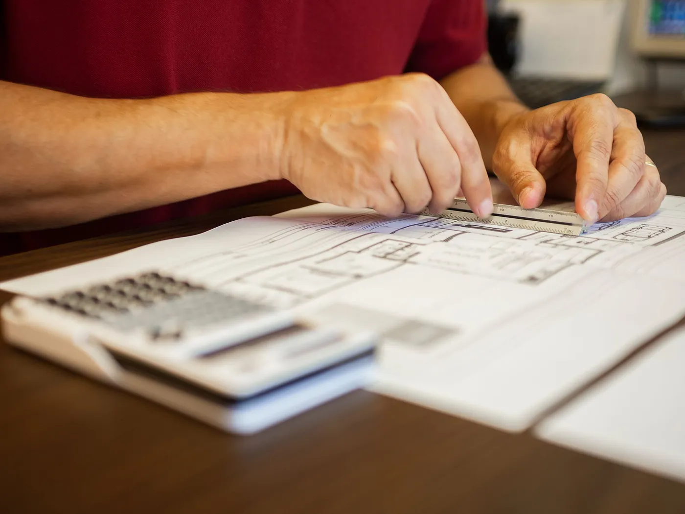 Floor plans and a calculator during project estimating
